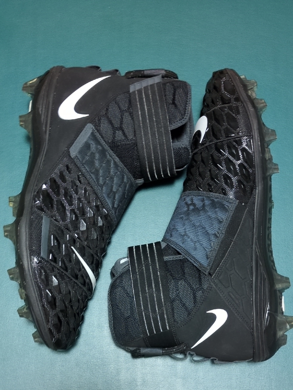 Nike Black Football Cleats with White Swoosh Accent